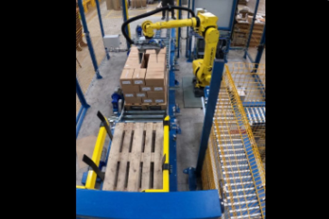 Robotic palletising and case packing line integrated with MES and ERP systems on a food manufacturing factory floor