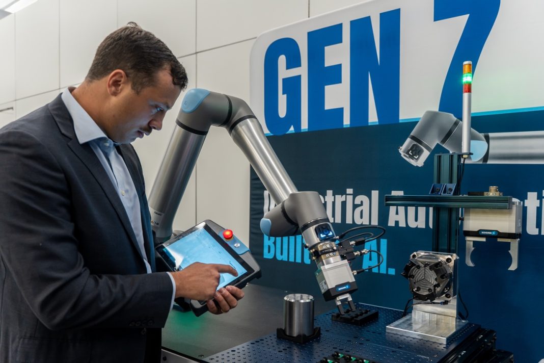 Universal Robots Gen 7 collaborative robot platform with new g-Series arm, CB7 controller, and TP7 teach pendant displayed at IMTS tradeshow