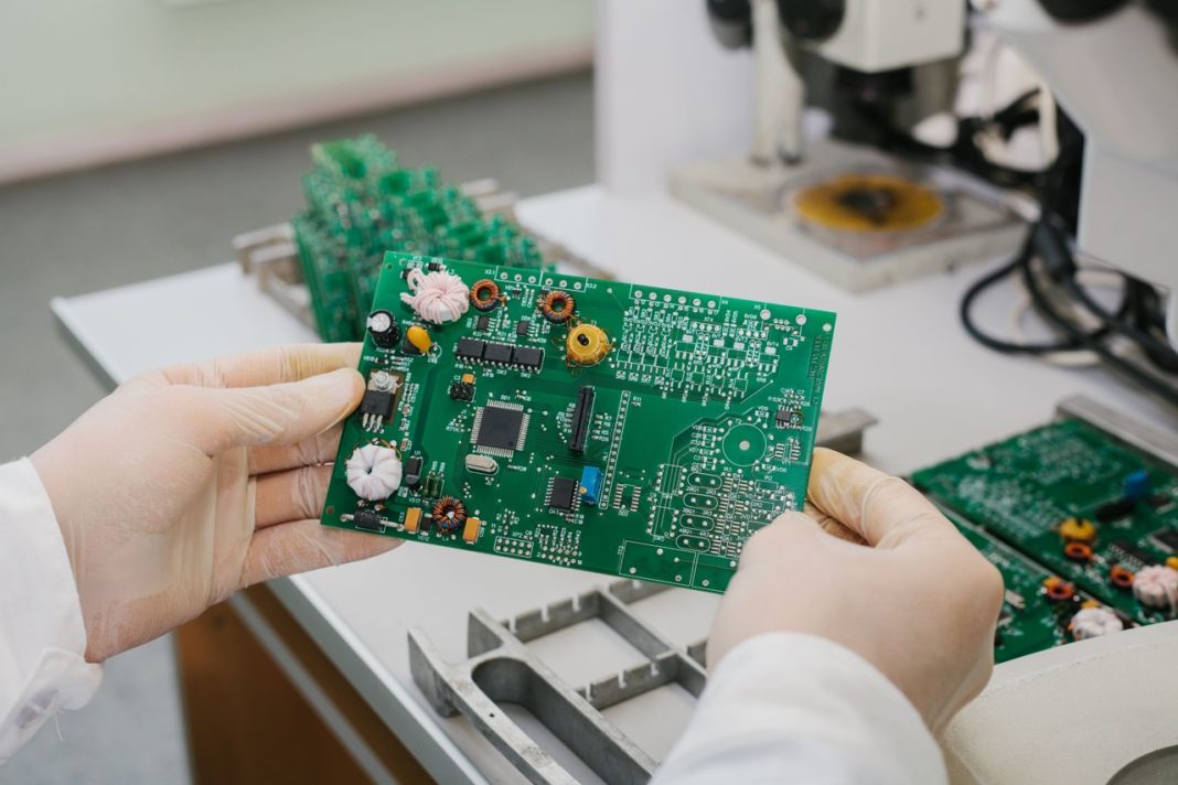 Electronic components including semiconductors, microcontrollers and passive components displayed at a trade show exhibition stand
