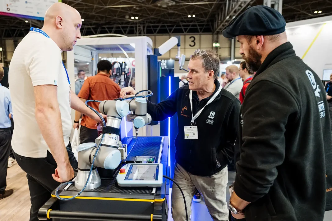 Investors and engineering business founders networking on the exhibition floor at NEC Birmingham during Advanced Engineering 2026