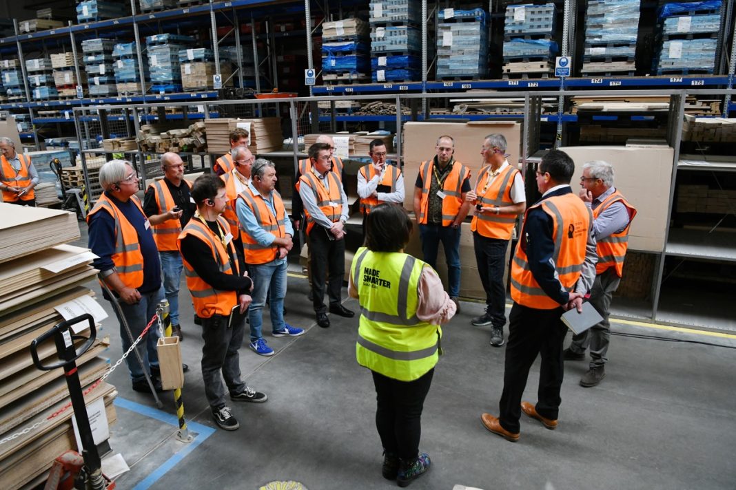Toyota Lean Management Centre coaches delivering a lean manufacturing workshop to SME manufacturers on a factory floor