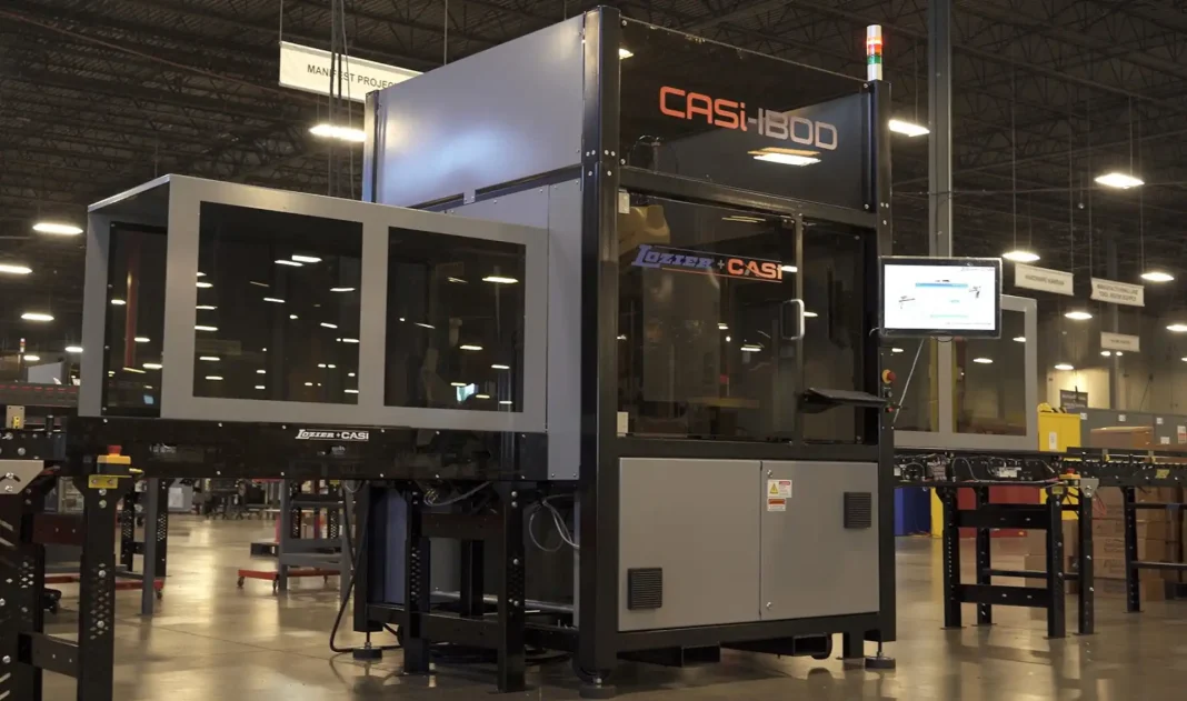 Automated box opening system processing inbound cartons on a conveyor in a modern warehouse logistics facility